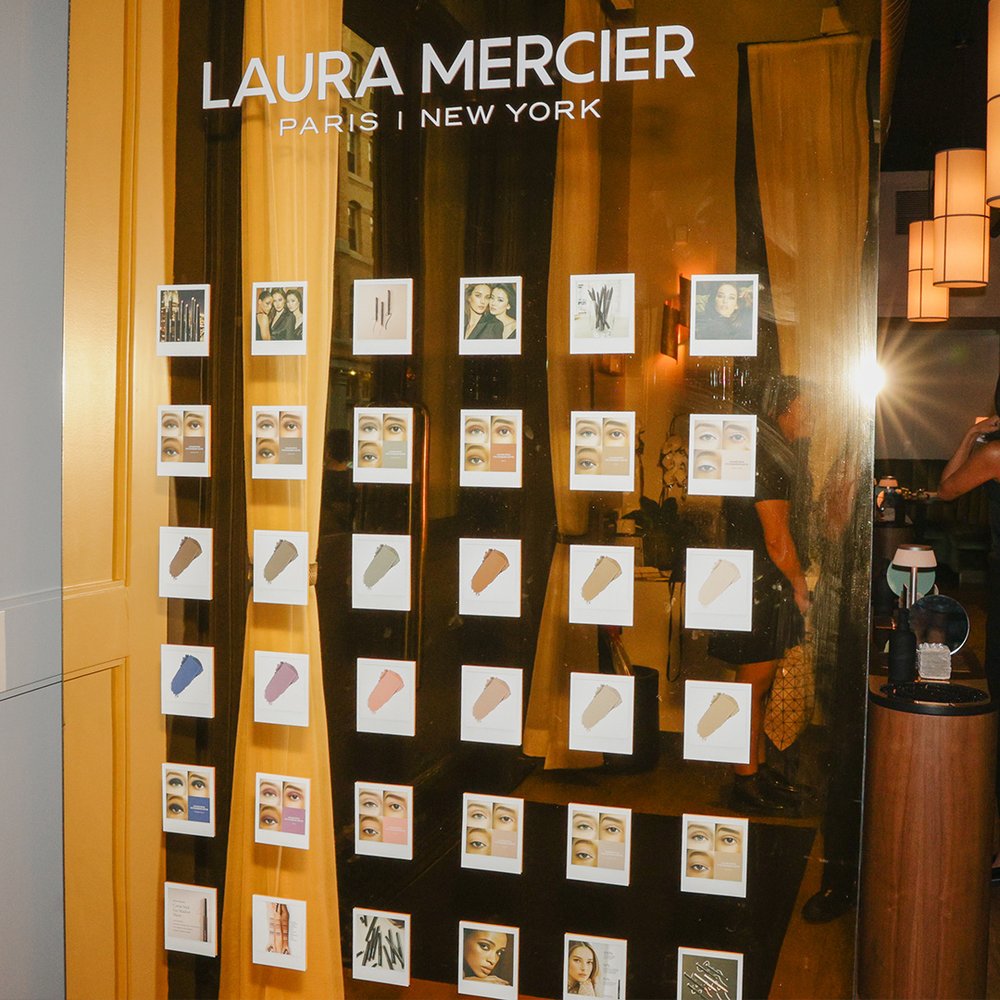 polaroid wall at laura mercier caviar eye shadow event