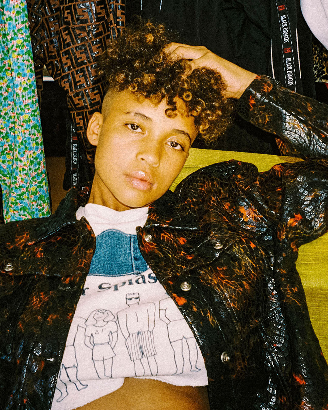 close up portrait sami miro vintage snake suit suit in front of smv sign