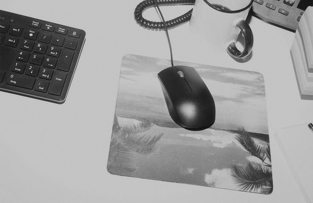 keyboard and mouse on palm tree mousepad