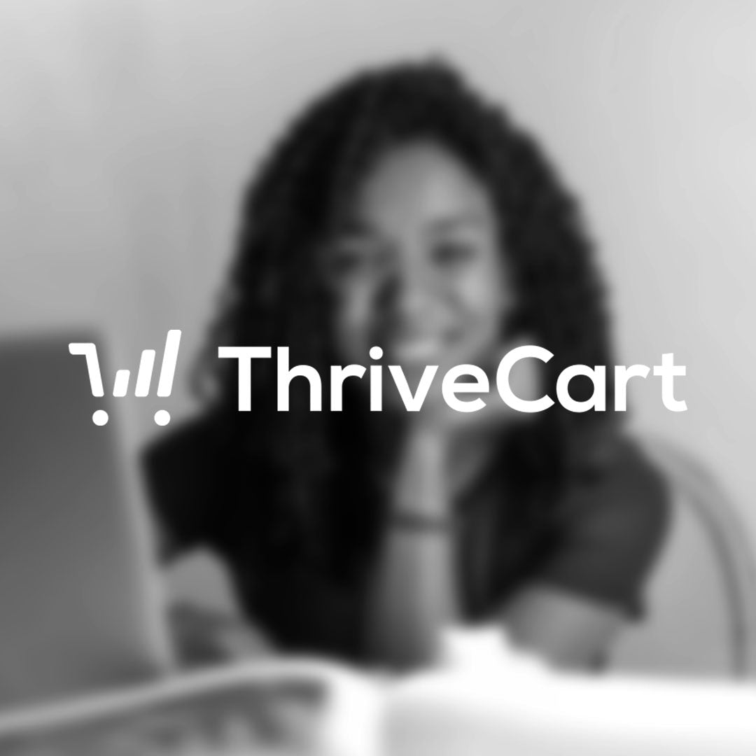 woman sitting at computer using thrivecart for her business